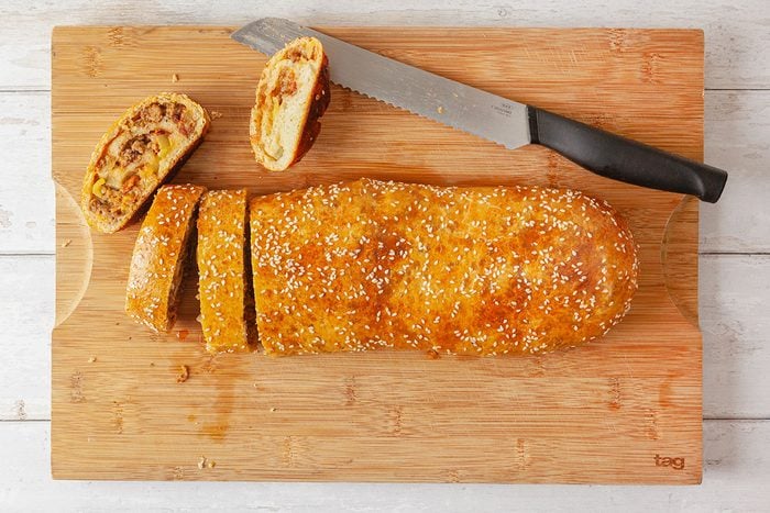 Baked garbage bread on a wooden tray