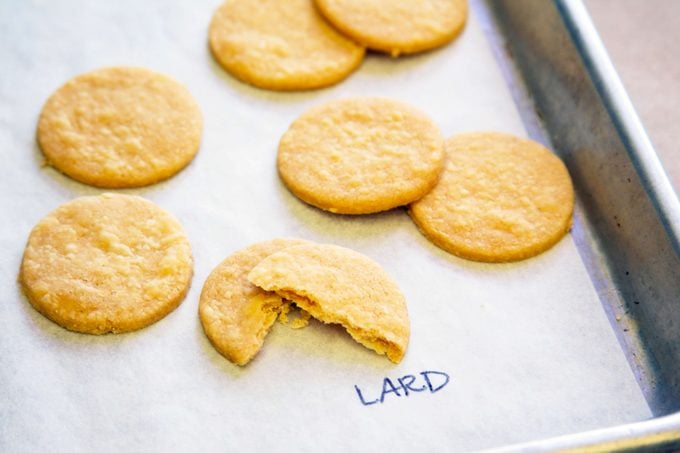 Pie crust with lard taste test - cookie-shaped pieces shown on a baking sheet labeled with "lard"