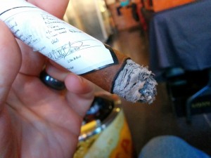 PSyKo SEVEN cigar with label corner near burn line 